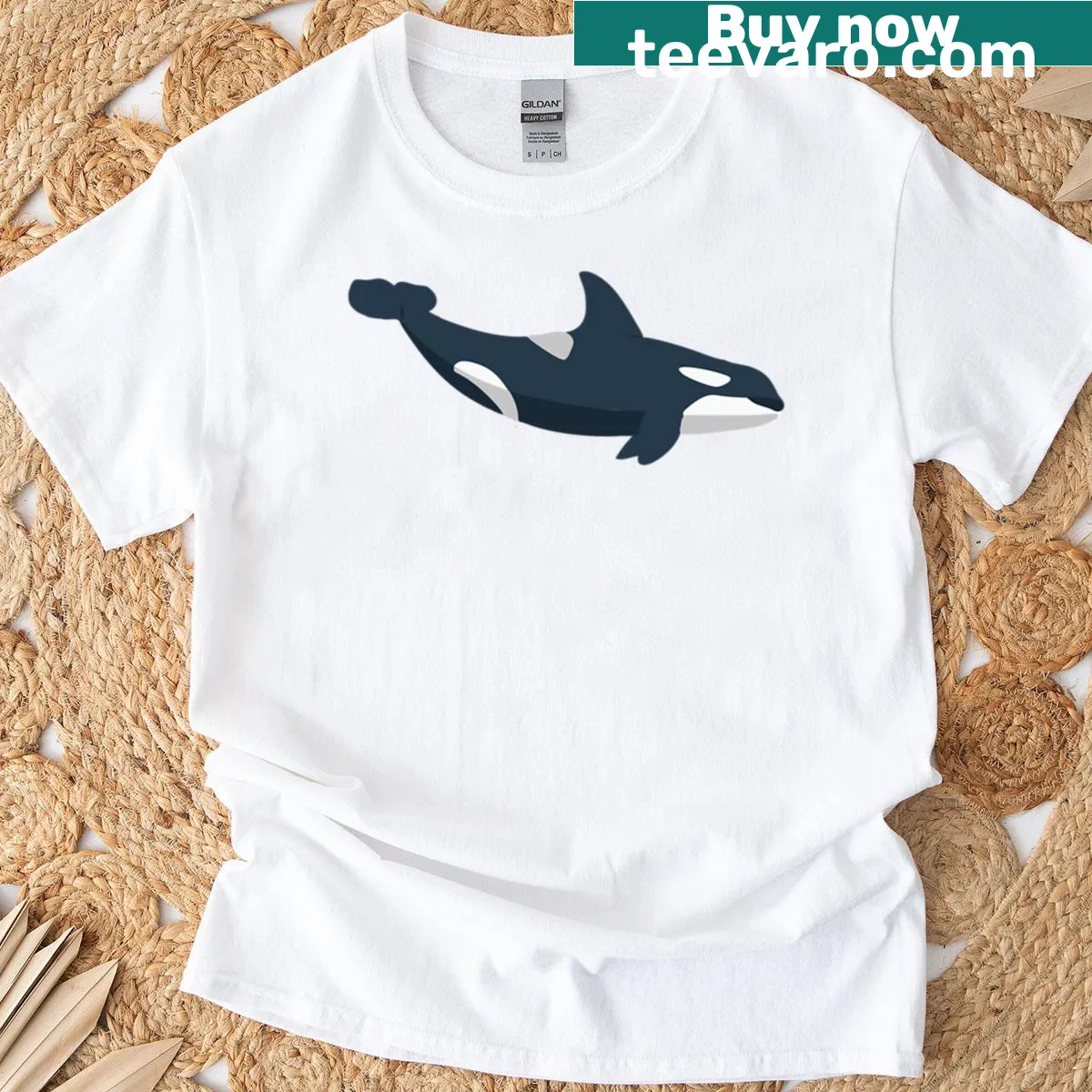 Minimalist cute orca whale graphic t-shirt — on a men's t-shirt
