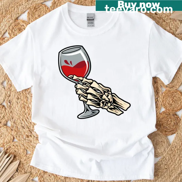Cartoon skeleton hand holding a wine glass for Halloween