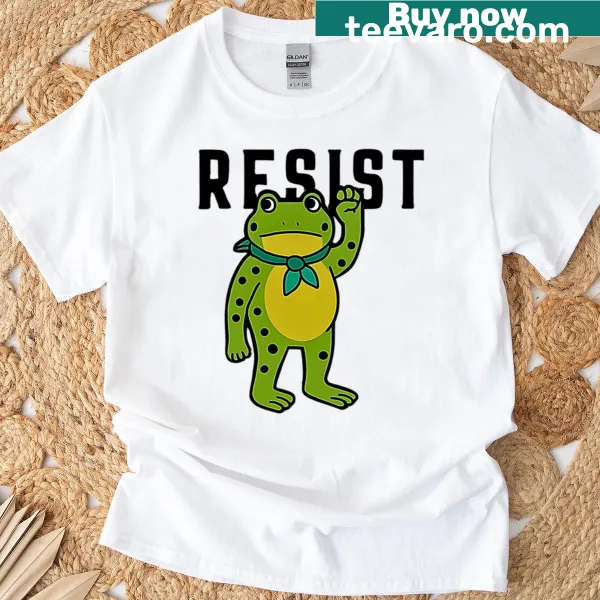 T-shirt with a whimsical frog design and 'Resist 2025' text