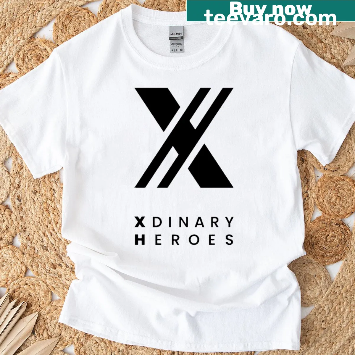 Illustrative Xdinary Heroes t-shirt with inspirational theme — on a men's t-shirt