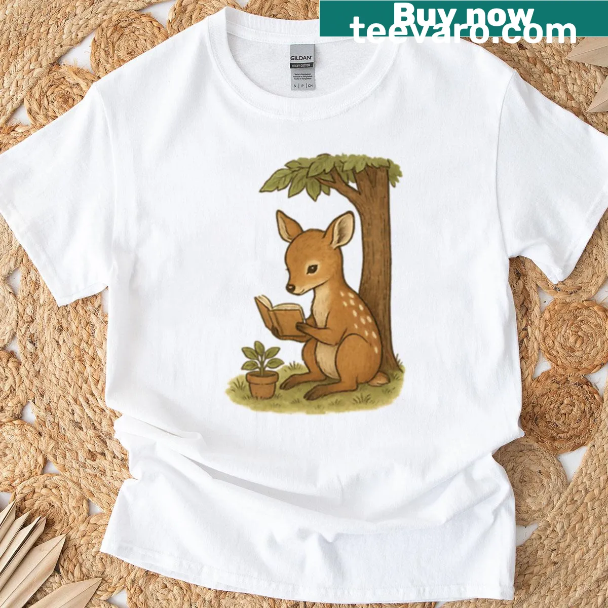 Illustration of a deer reading under a tree on a t-shirt — on a men's t-shirt
