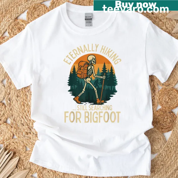 Funny skeleton with Bigfoot on a hiking T-shirt.