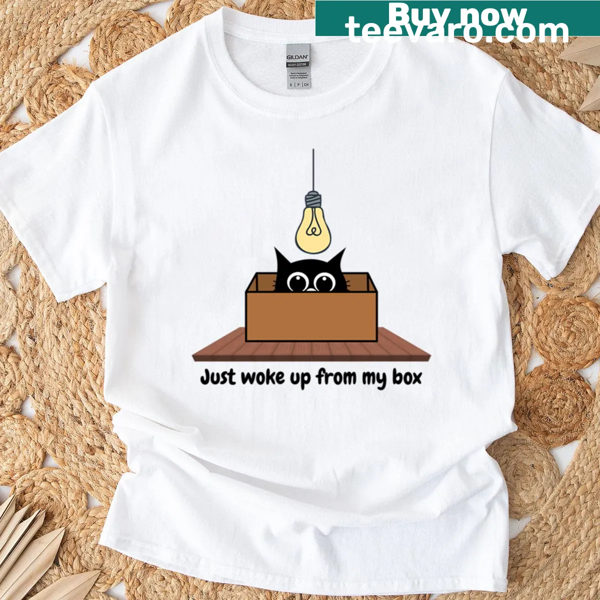 Funny cat design t-shirt depicting a cat waking up from a box — on a men's t-shirt