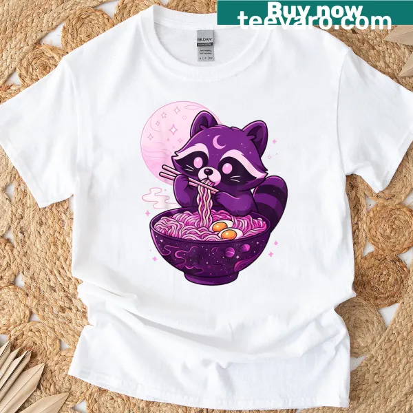 Kawaii raccoon illustration eating ramen on a pastel goth-themed shirt
