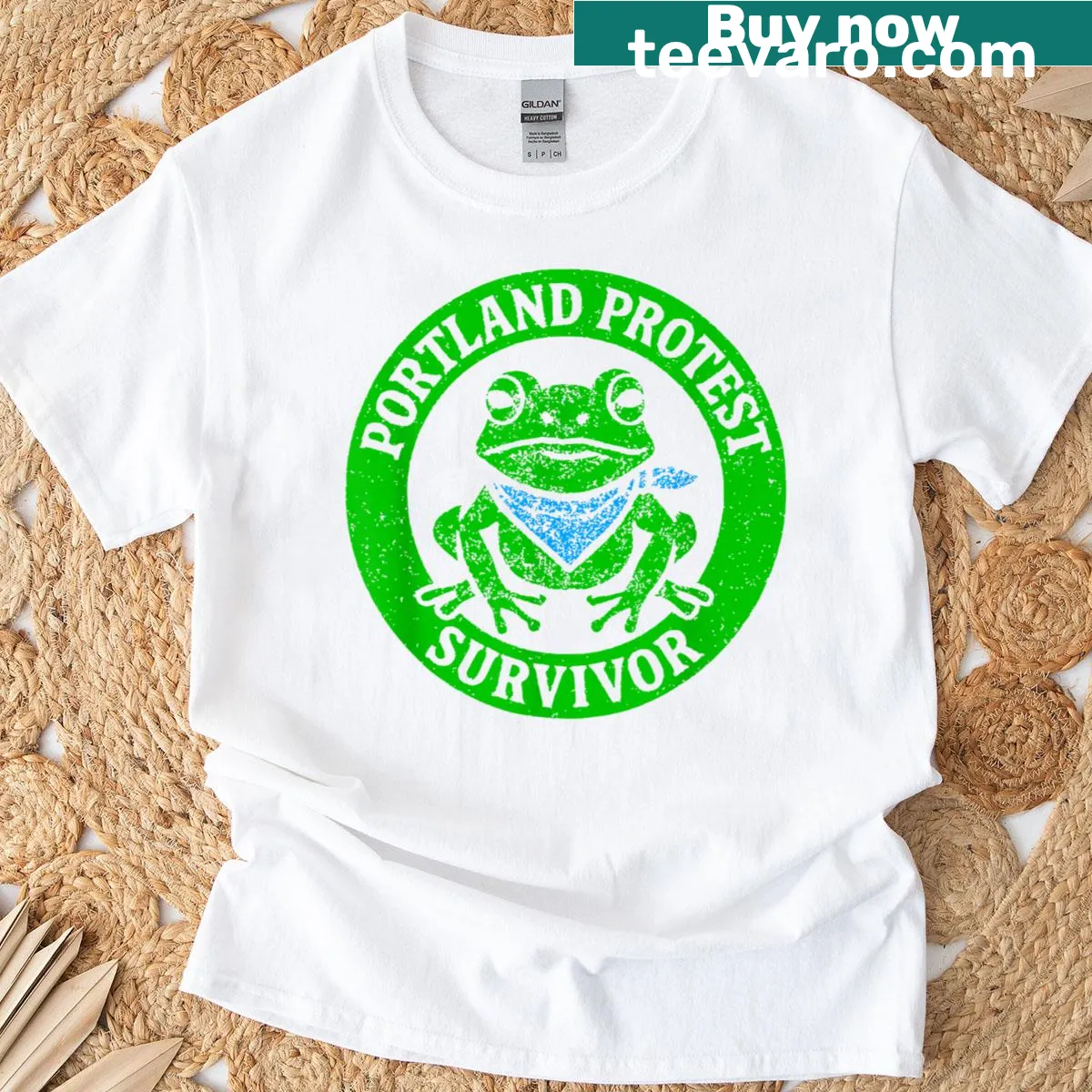 Funny protest frog graphic t-shirt with survivor theme — on a men's t-shirt