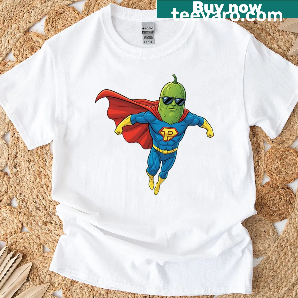 Cartoon pickle character in superhero pose on t-shirt — on a men's t-shirt