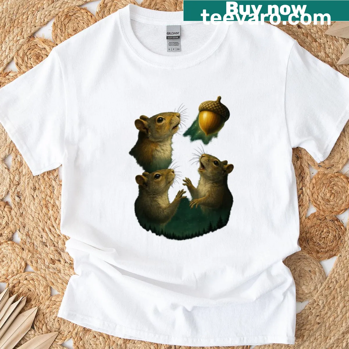 Playful T-shirt with three cartoon squirrels and acorns — on a men's t-shirt