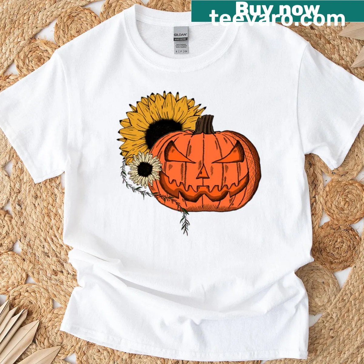 Illustrated pumpkin surrounded by floral elements on a T-shirt — on a men's t-shirt
