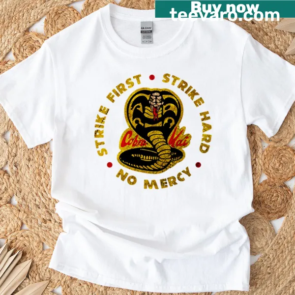 Bold text 'Strike First - Strike Hard' from Cobra Kai on a t-shirt