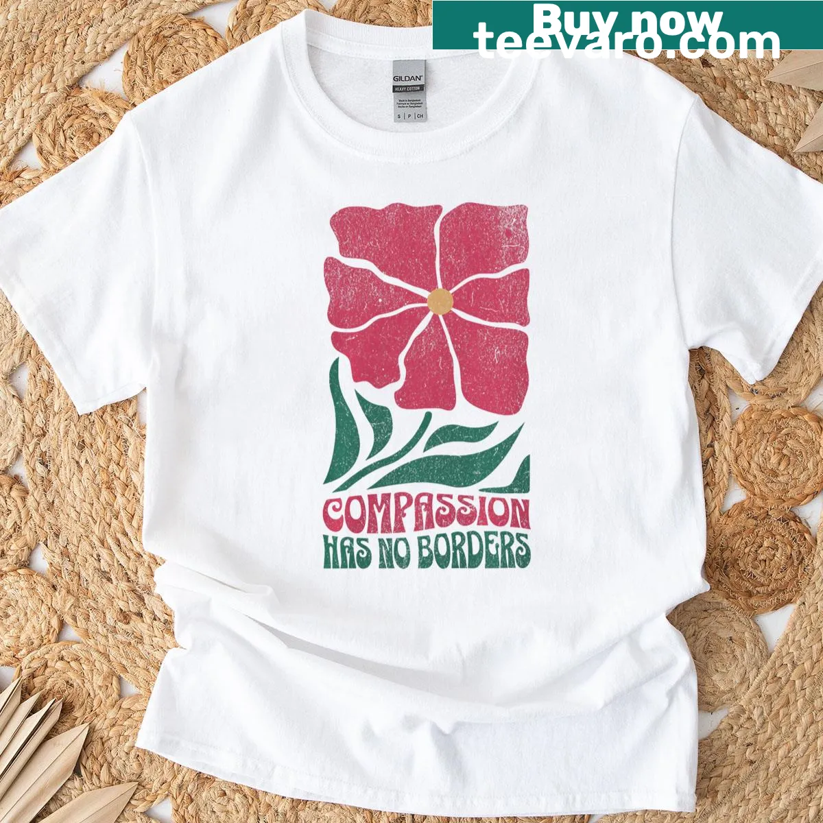 Boho floral design with the phrase 'Compassion Has No Borders' on t-shirt — on a men's t-shirt
