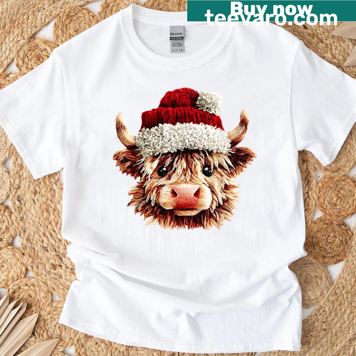 Highland cow wearing a Santa hat illustrated on a t-shirt — on a men's t-shirt