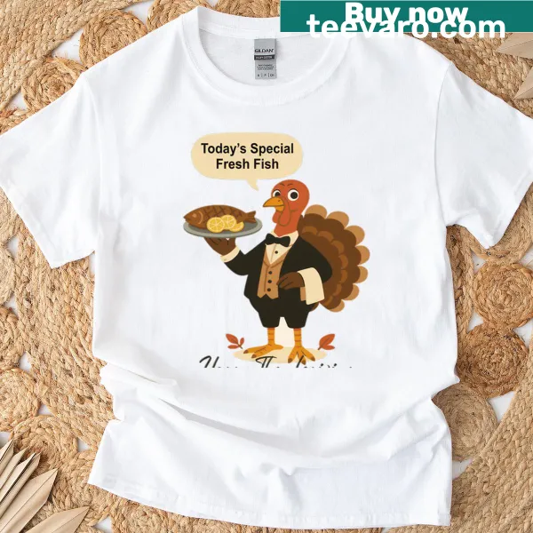 Funny T-shirt with a turkey waiter serving fresh fish on Thanksgiving