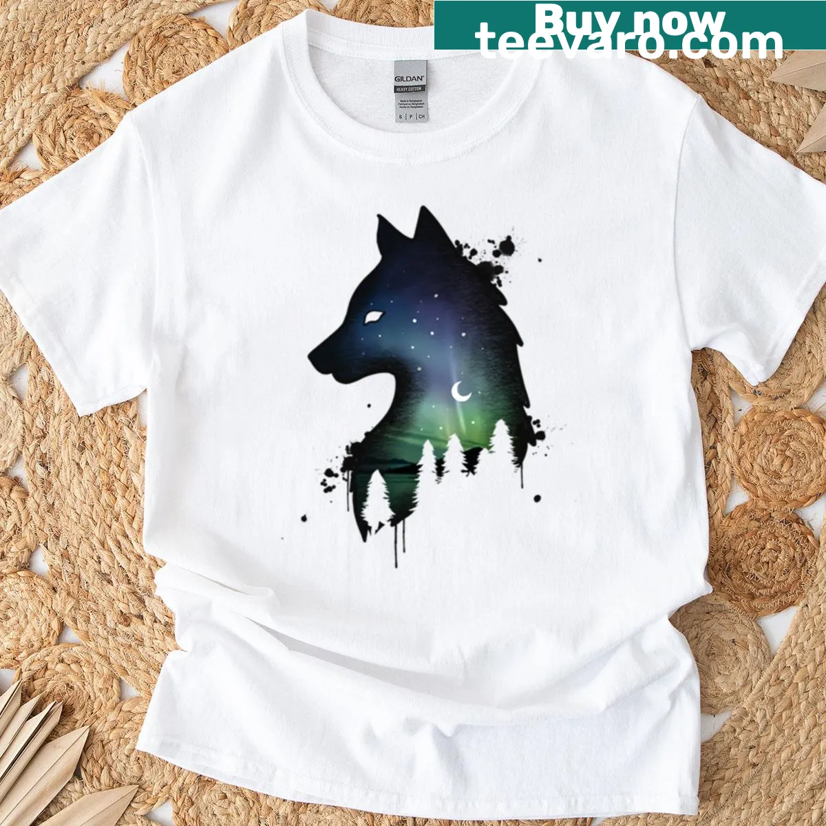 T-shirt featuring an ink splatter wolf design — on a men's t-shirt
