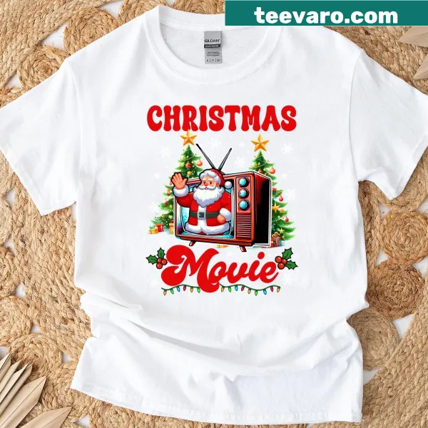 Festive Christmas Movie Santa T-shirt with a tree design.