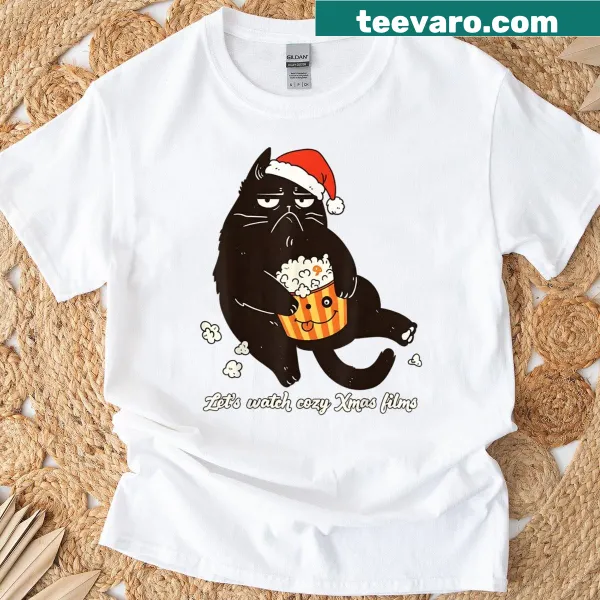Cozy Christmas cat graphic tee with popcorn and movie theme