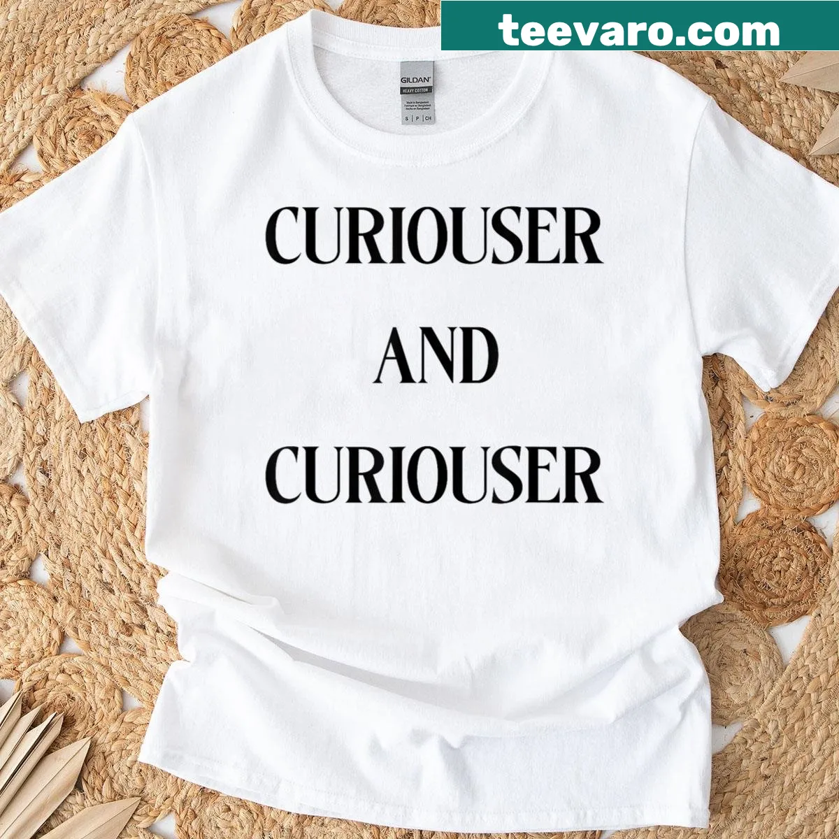Funny T-shirt featuring the quote 'Curiouser And Curiouser' in bold typography. — on a men's t-shirt