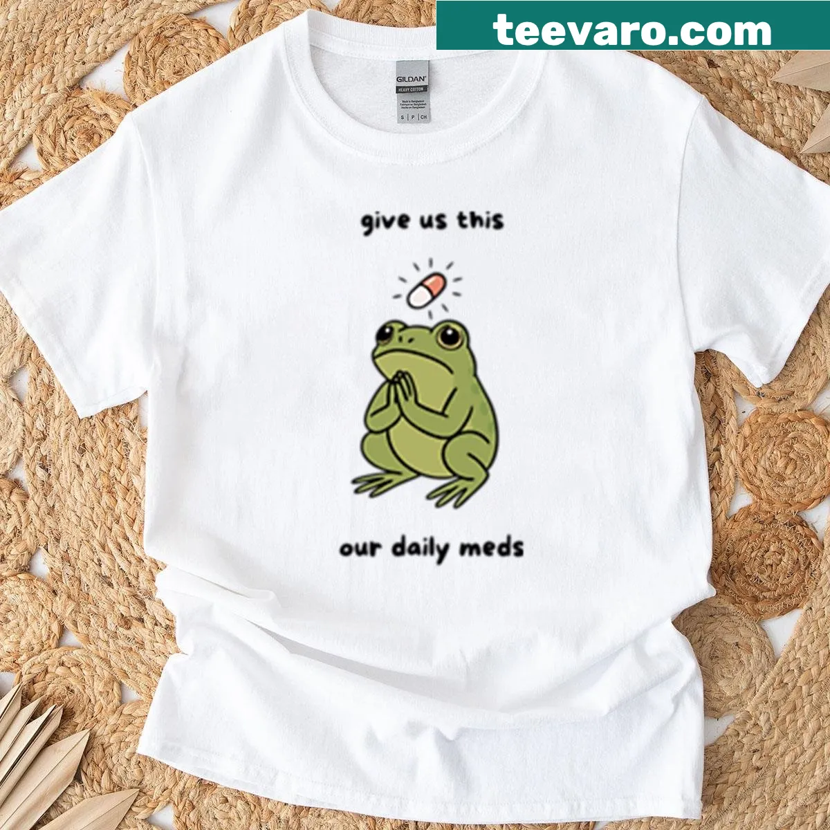 Cartoon T-shirt featuring a funny praying frog design related to daily meds — on a men's t-shirt