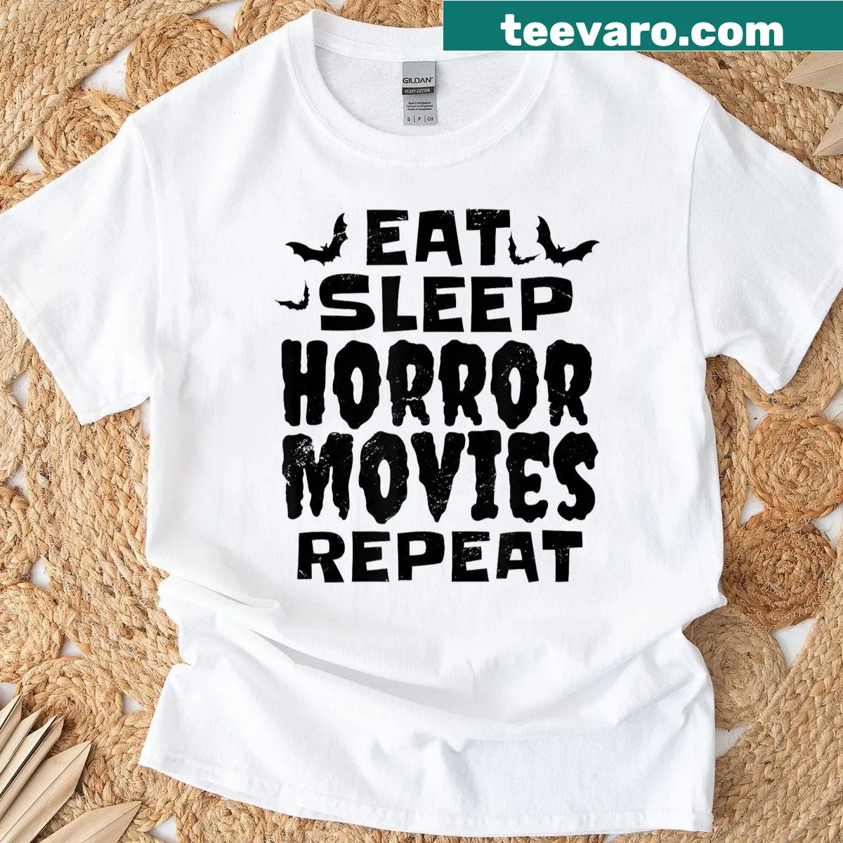 T-shirt with the phrase 'Eat Sleep Horror Movies Repeat' in bold letters. — on a men's t-shirt