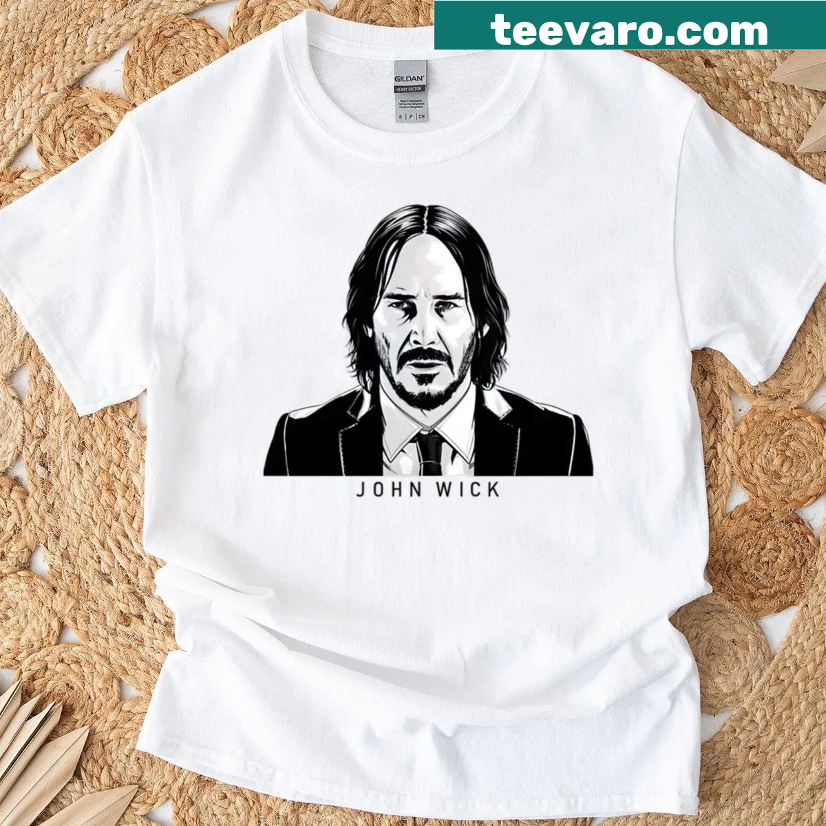 Vintage graphic t-shirt featuring John Wick and Keanu Reeves. — on a men's t-shirt