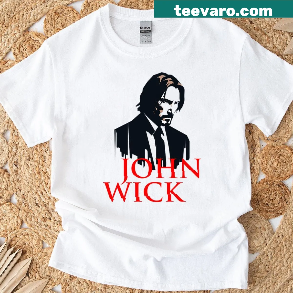 Retro John Wick T-shirt featuring a bold face illustration — on a men's t-shirt