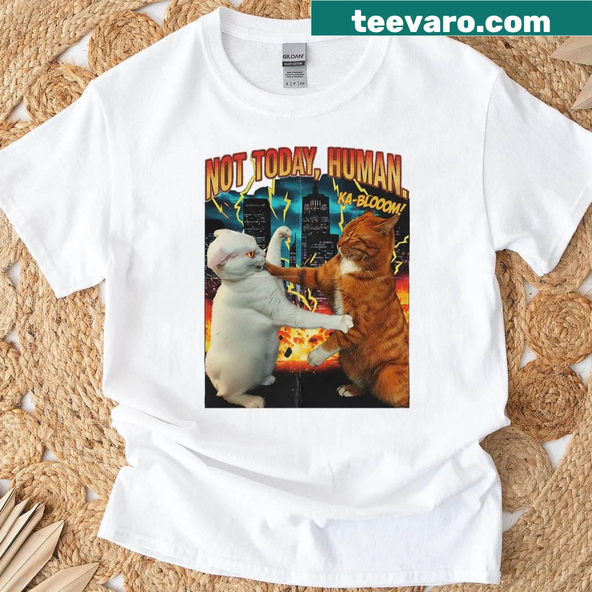 Oversized t-shirt featuring a retro movie poster design of an epic cat fight. — on a men's t-shirt