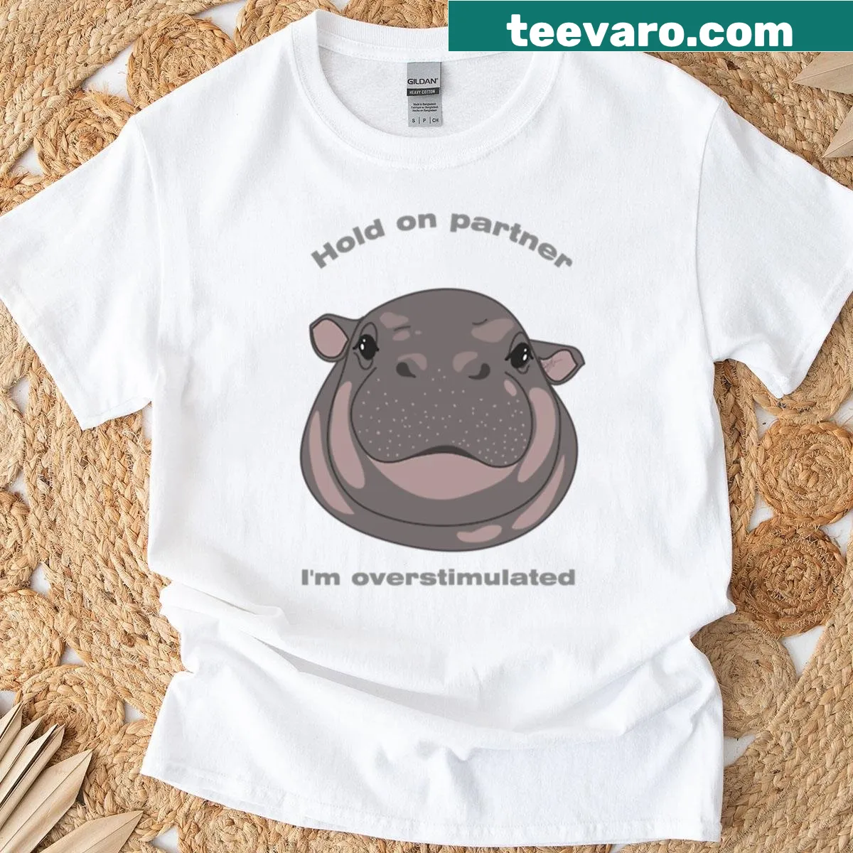 Cute illustrated baby hippo with a funny expression on T-shirt — on a men's t-shirt