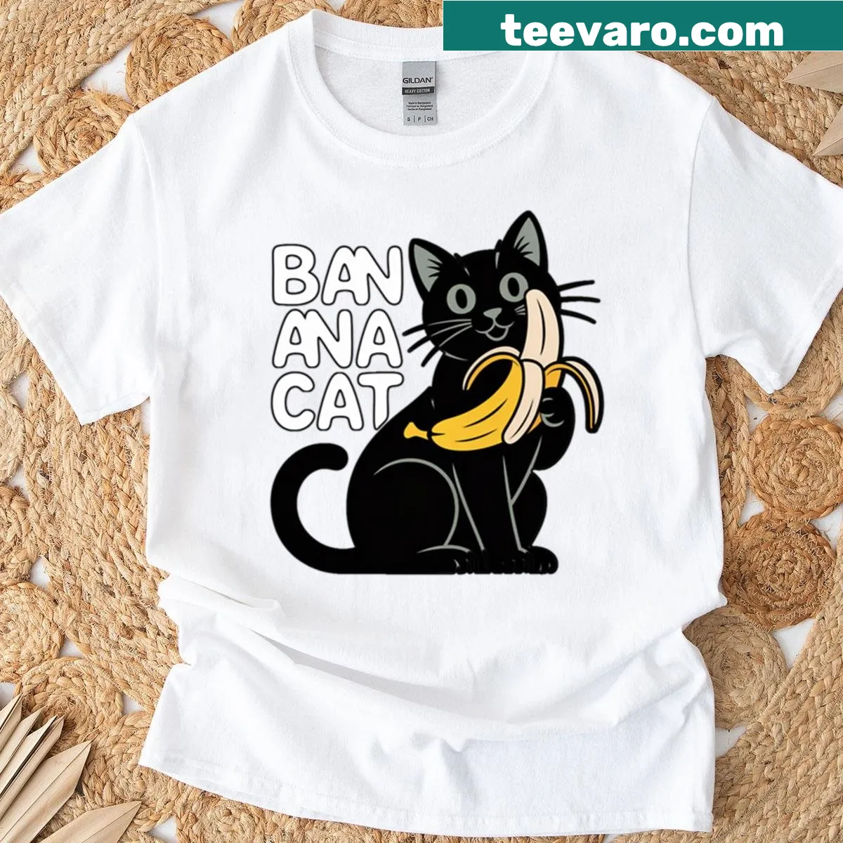 Minimalist cartoon cat playing with a banana graphic t-shirt — on a men's t-shirt