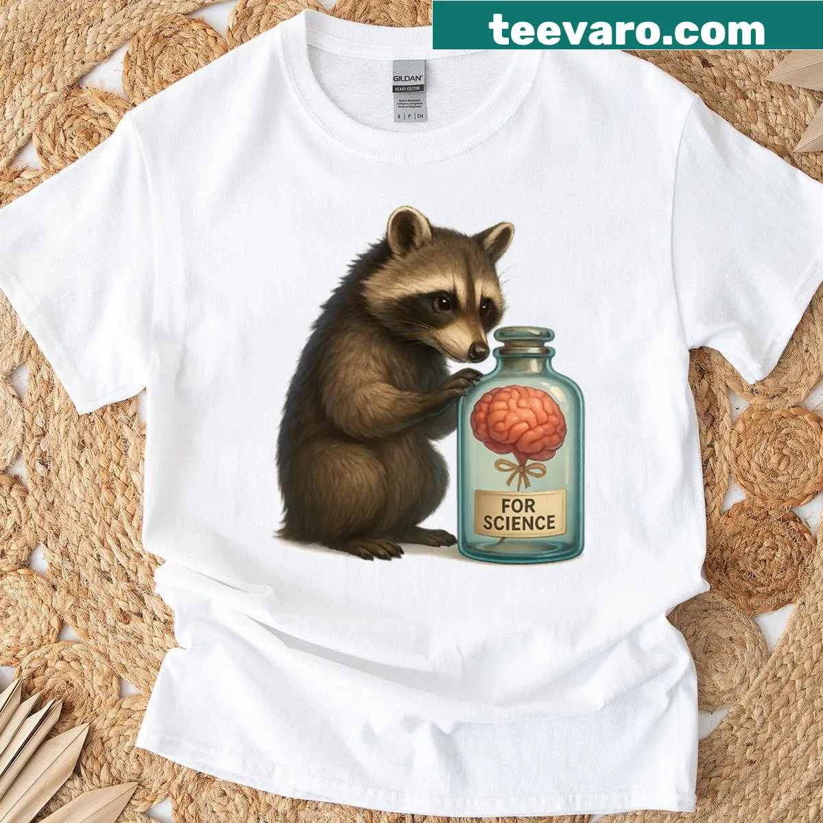 T-shirt featuring a whimsical raccoon graphic — on a men's t-shirt