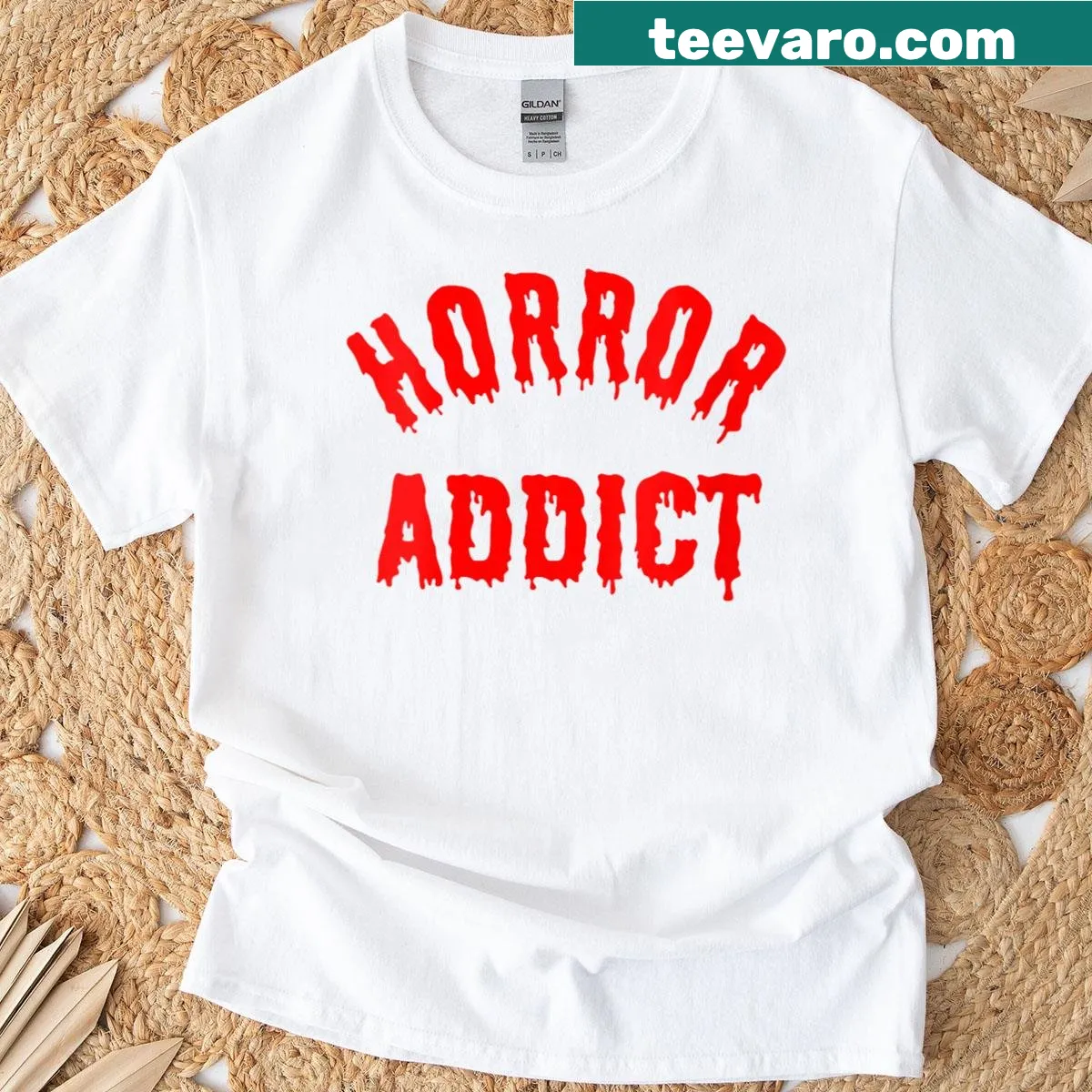 Horror-themed women's t-shirt with spooky graphics and typography — on a men's t-shirt