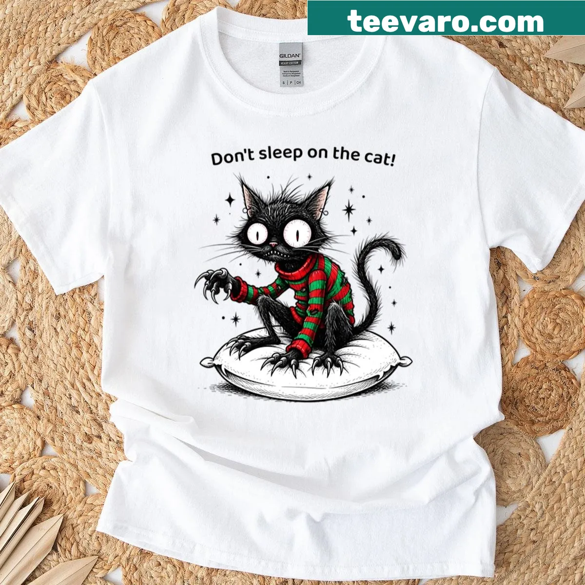 Funny Halloween T-shirt featuring spooky cartoon cat — on a men's t-shirt
