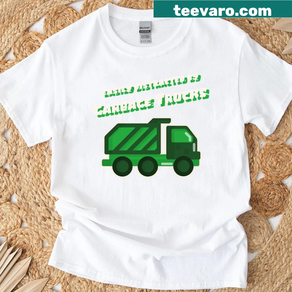 Kids t-shirt that reads 'Easily Distracted By Garbage Trucks' in playful font — on a men's t-shirt
