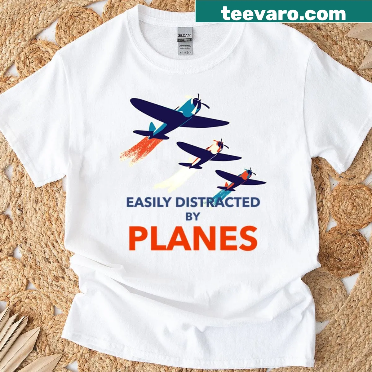 Playful text on a pilot-themed t-shirt about distractions by planes — on a men's t-shirt