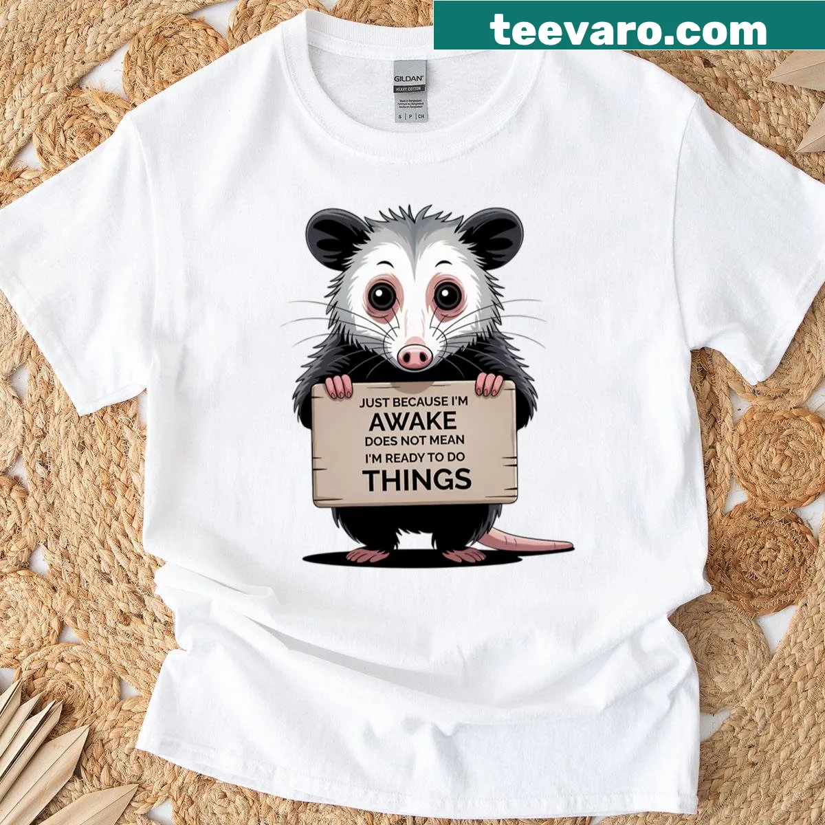 Sleepy opossum graphic with humorous text on a coffee-themed t-shirt — on a men's t-shirt