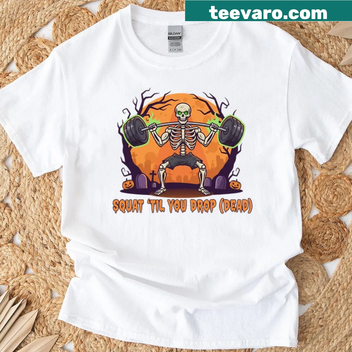 Funny skeleton lifting weights graphic for Halloween — on a men's t-shirt