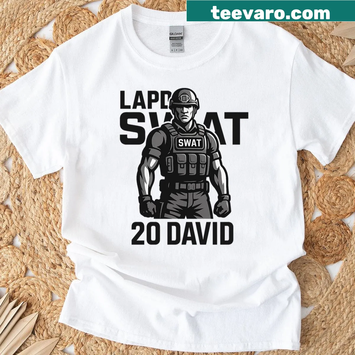Graphic T-shirt featuring an action illustration of Hondo in a swat team setting. — on a men's t-shirt