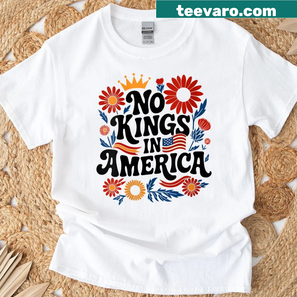 Floral-accented T-shirt with the phrase 'No King In America'. — on a men's t-shirt