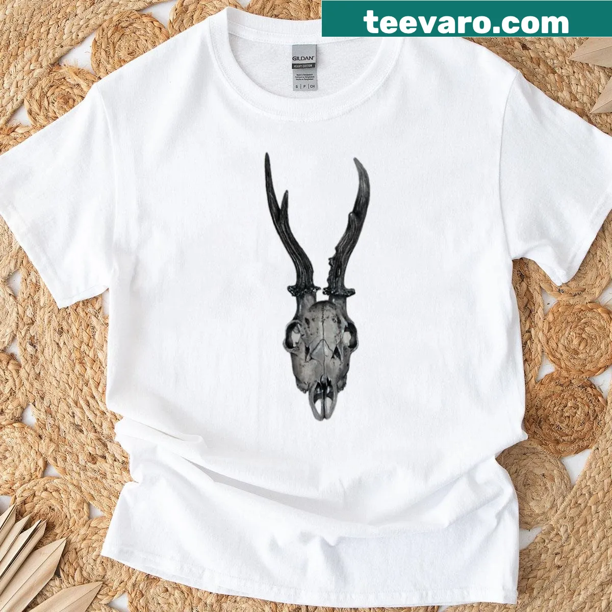 T-shirt featuring a bold illustration of a buck skull — on a men's t-shirt