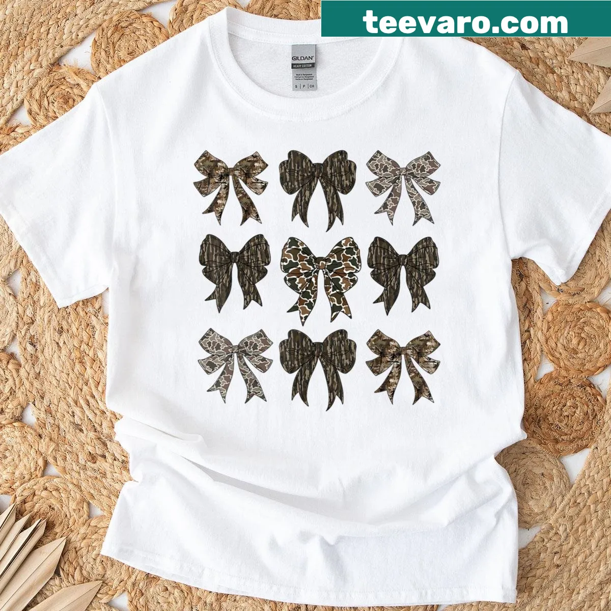 Camo pattern T-shirt with a playful bow design — on a men's t-shirt