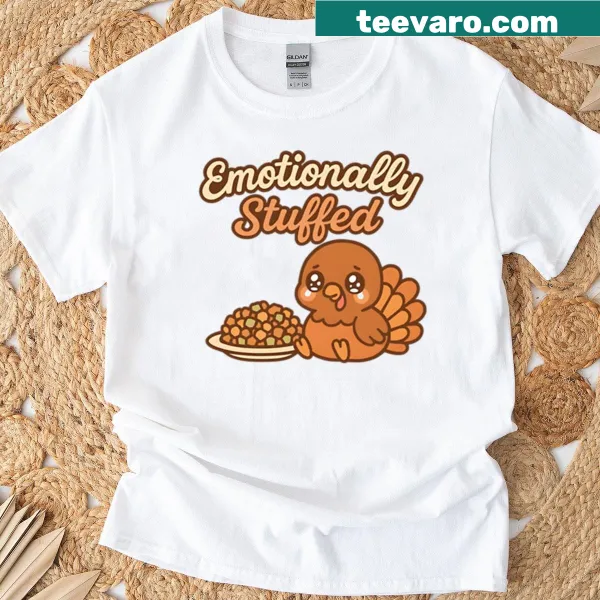 Text graphic on a t-shirt saying 'Emotionally Stuffed'
