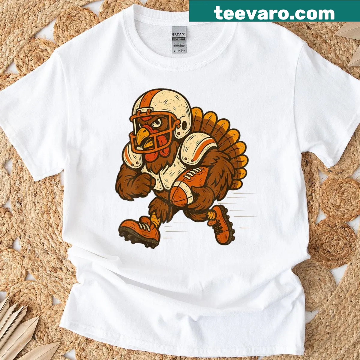 Cartoon turkey playing football on Thanksgiving T-shirt — on a men's t-shirt
