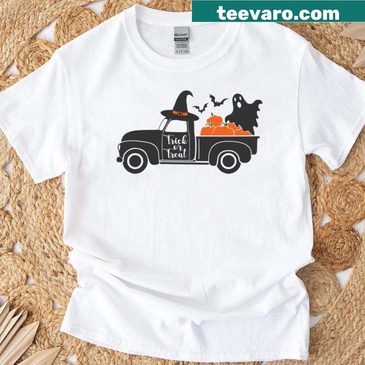 Playful t-shirt depicting a car in a Halloween trick-or-treat scene — on a men's t-shirt