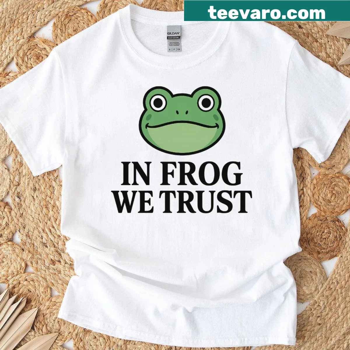 Playful frog illustration with 'In Frog We Trust' text on T-shirt. — on a men's t-shirt