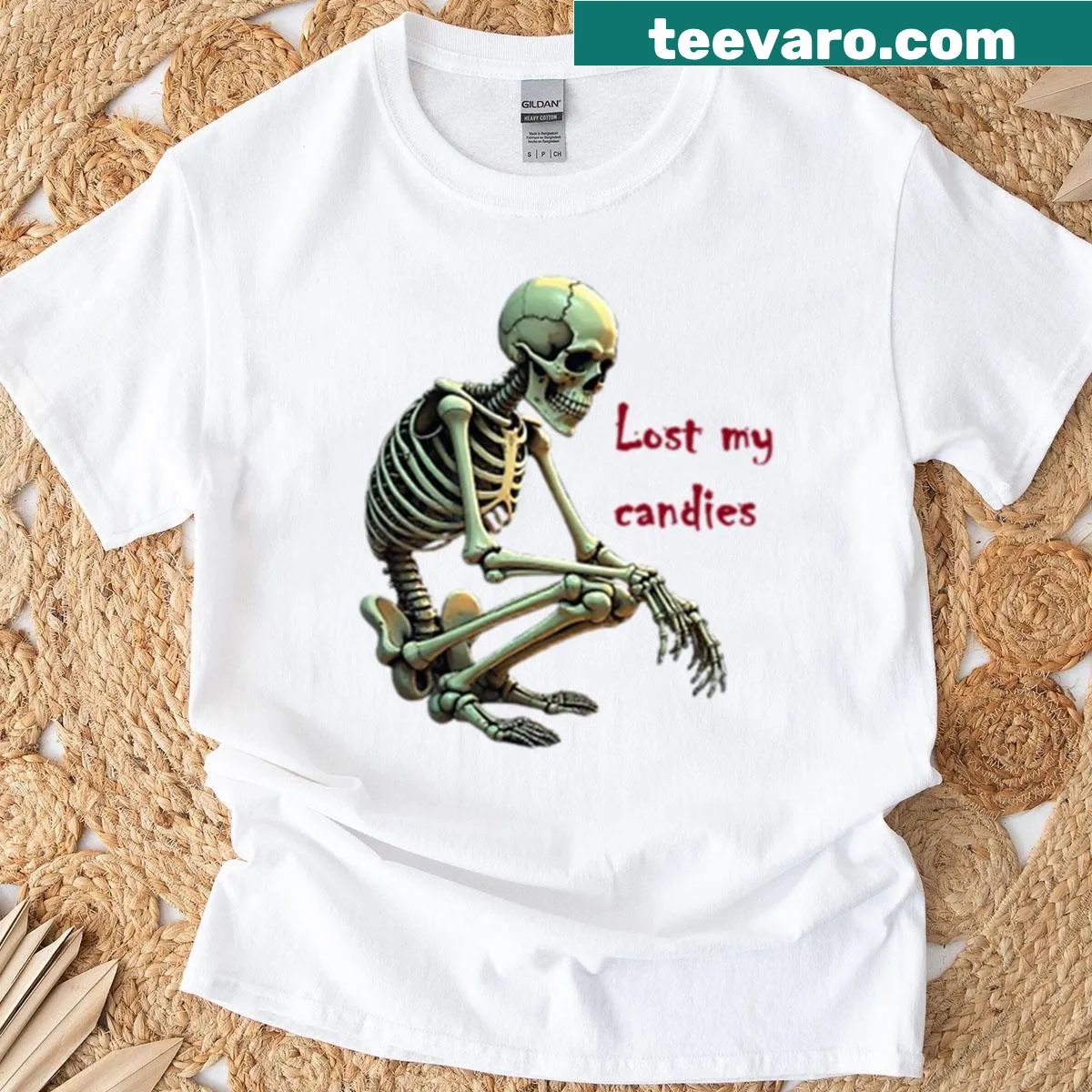 Playful skeleton graphic lamenting lost candies on oversized t-shirt — on a men's t-shirt