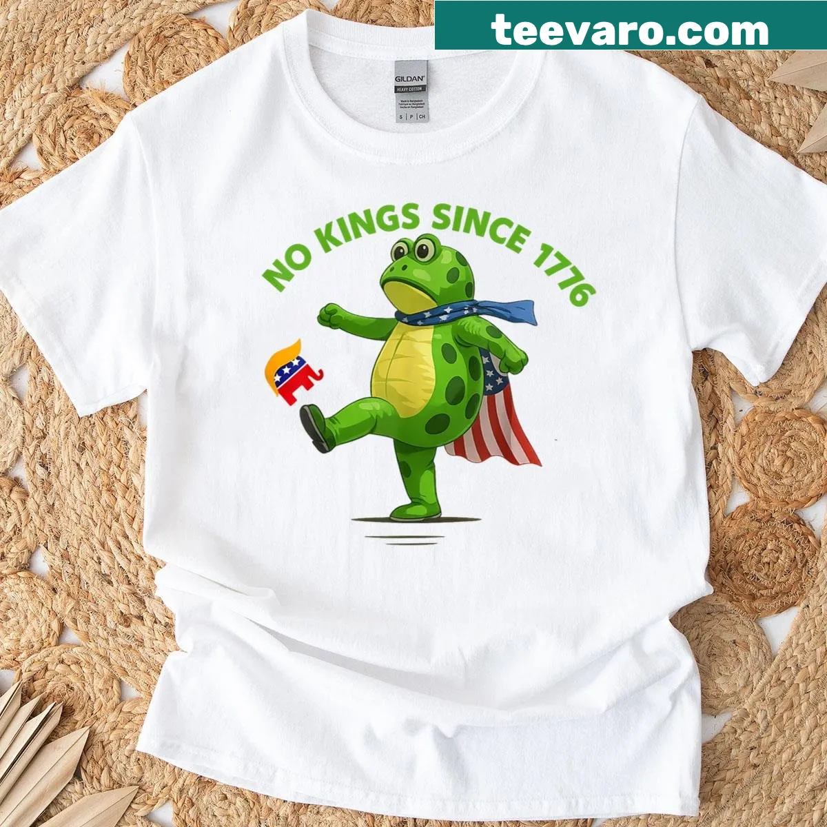 Edgy frog kicking crown graphic t-shirt with No Kings In America text — on a men's t-shirt