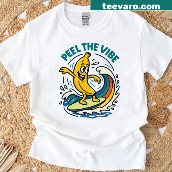 Cartoon banana surfing on a rainbow wave graphic t-shirt