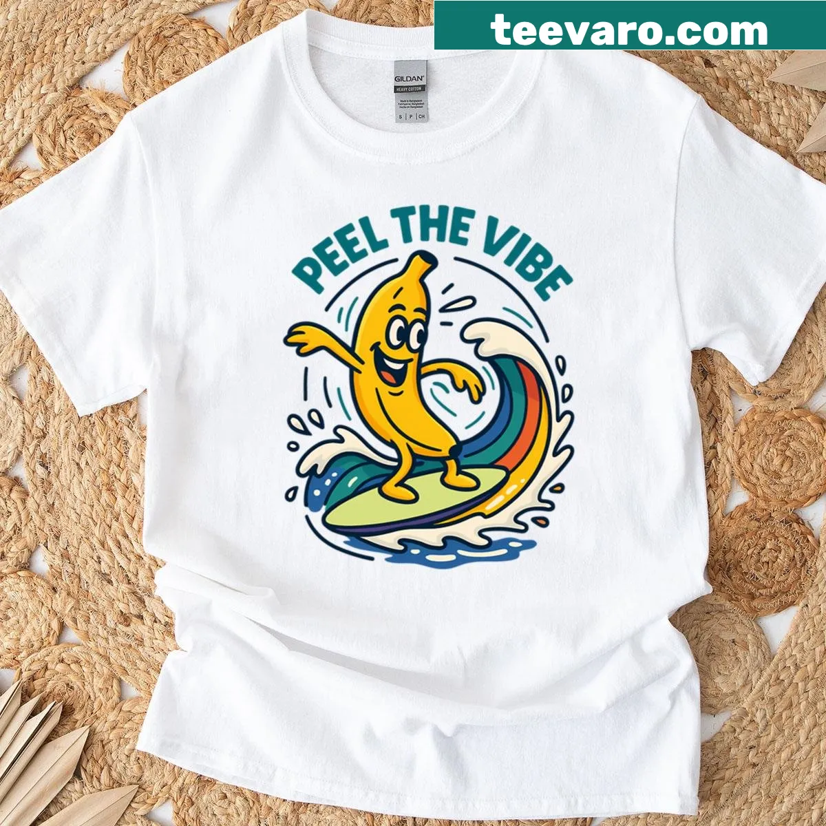 Cartoon banana surfing on a rainbow wave graphic t-shirt — on a men's t-shirt