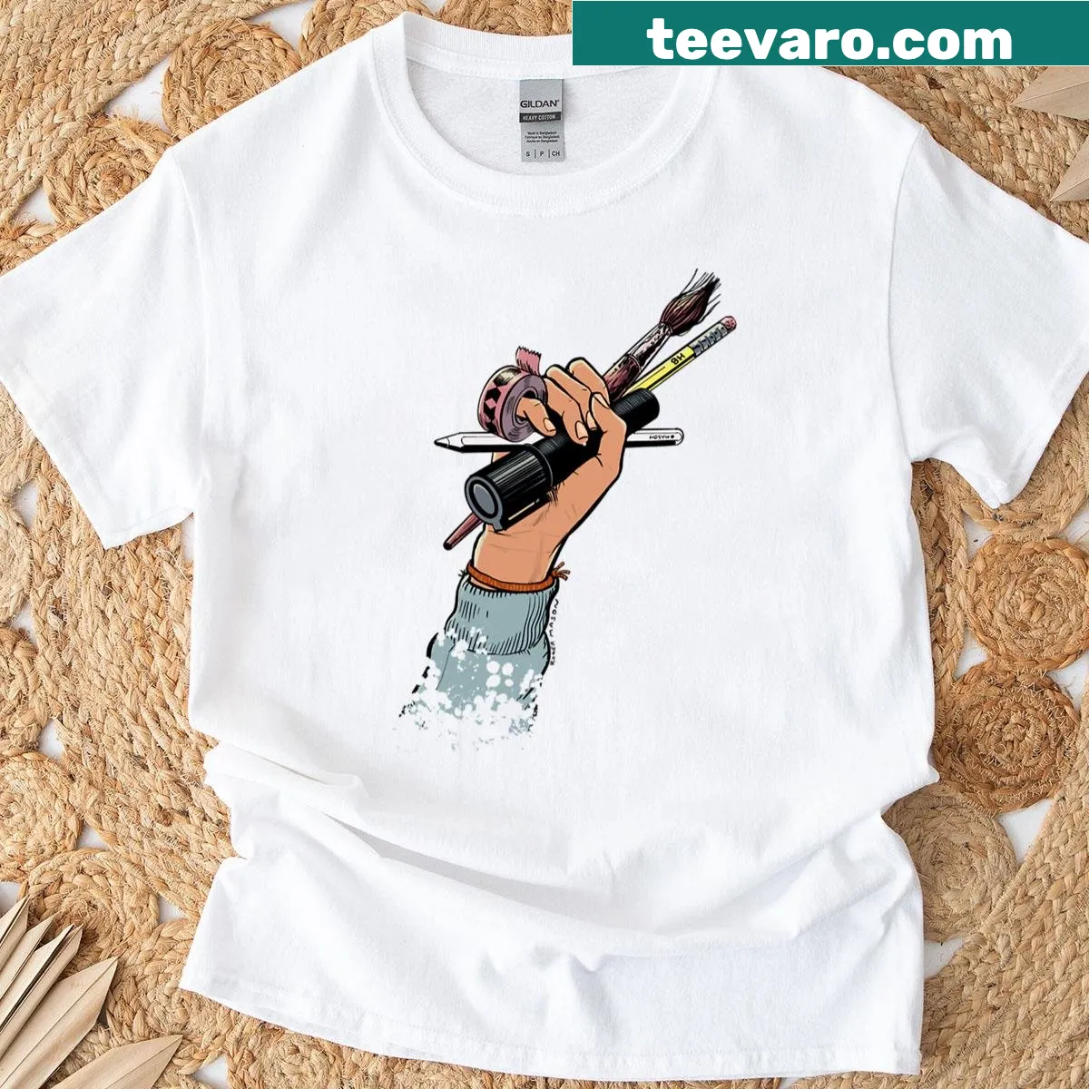 Bold artist tools graphic on a typography tee for creative students — on a men's t-shirt