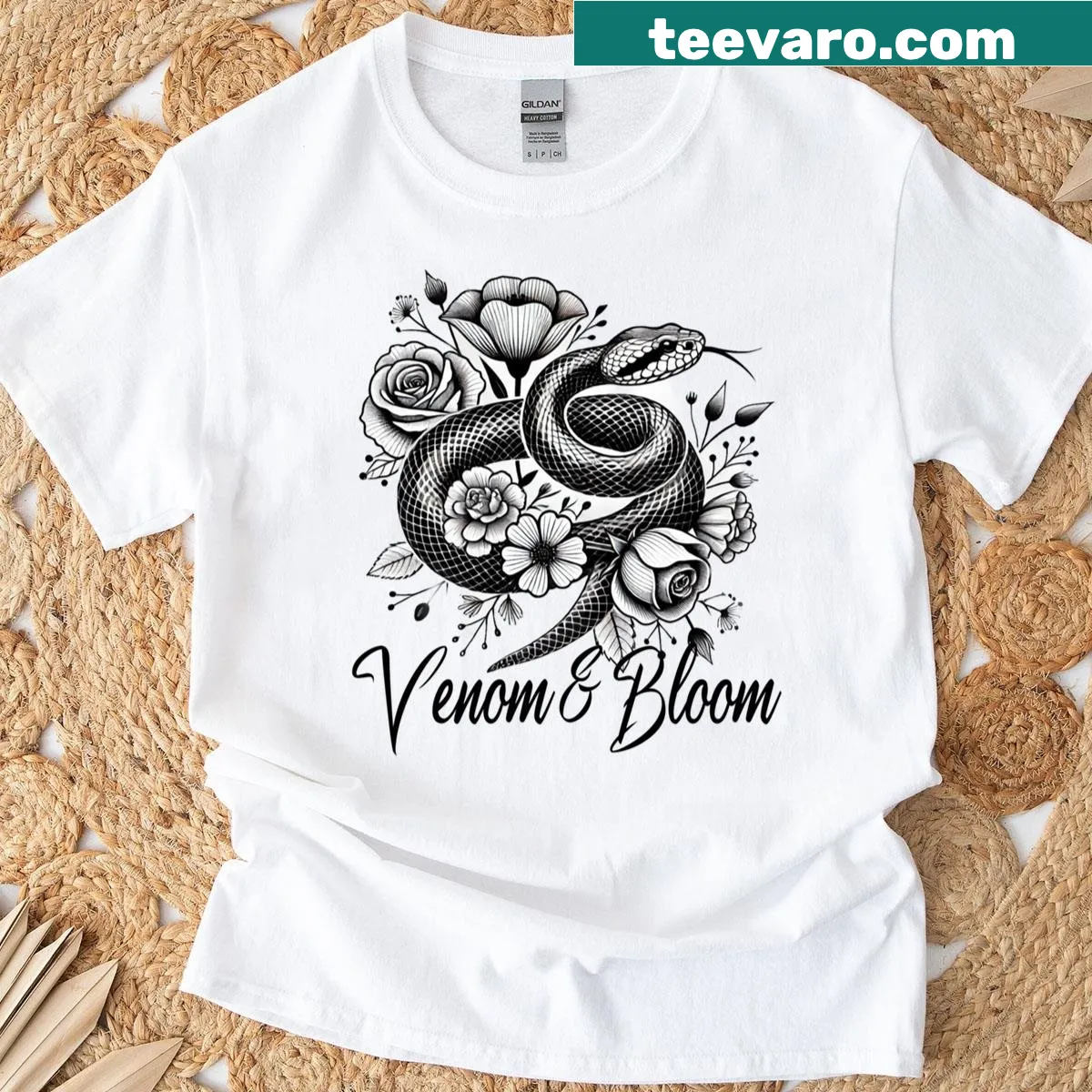 Snake and floral tattoo art style t-shirt — on a men's t-shirt