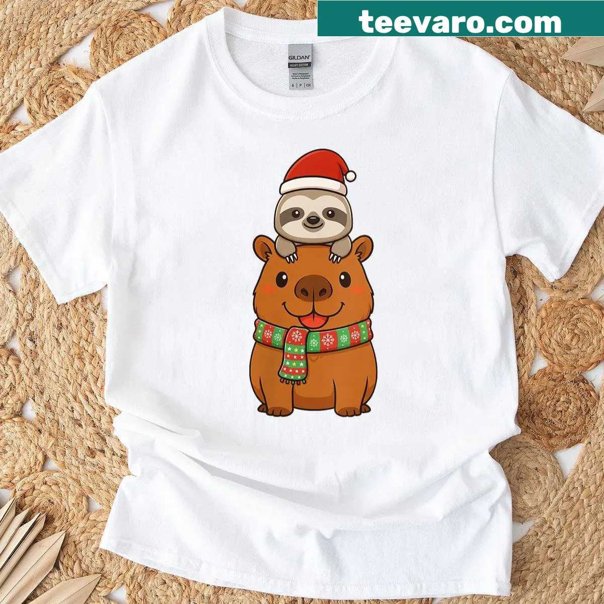Funny Christmas graphic t-shirt featuring a capybara and sloth — on a men's t-shirt