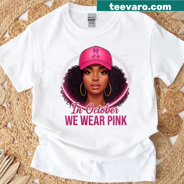 Black tee with 'In October We Wear Pink' text and queen graphic